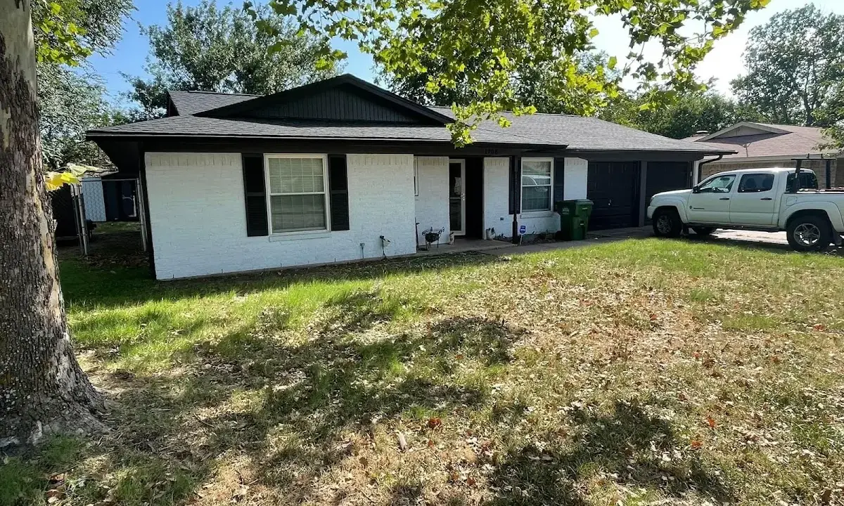 Professional roofing crew working on a residential roof in Pittsboro